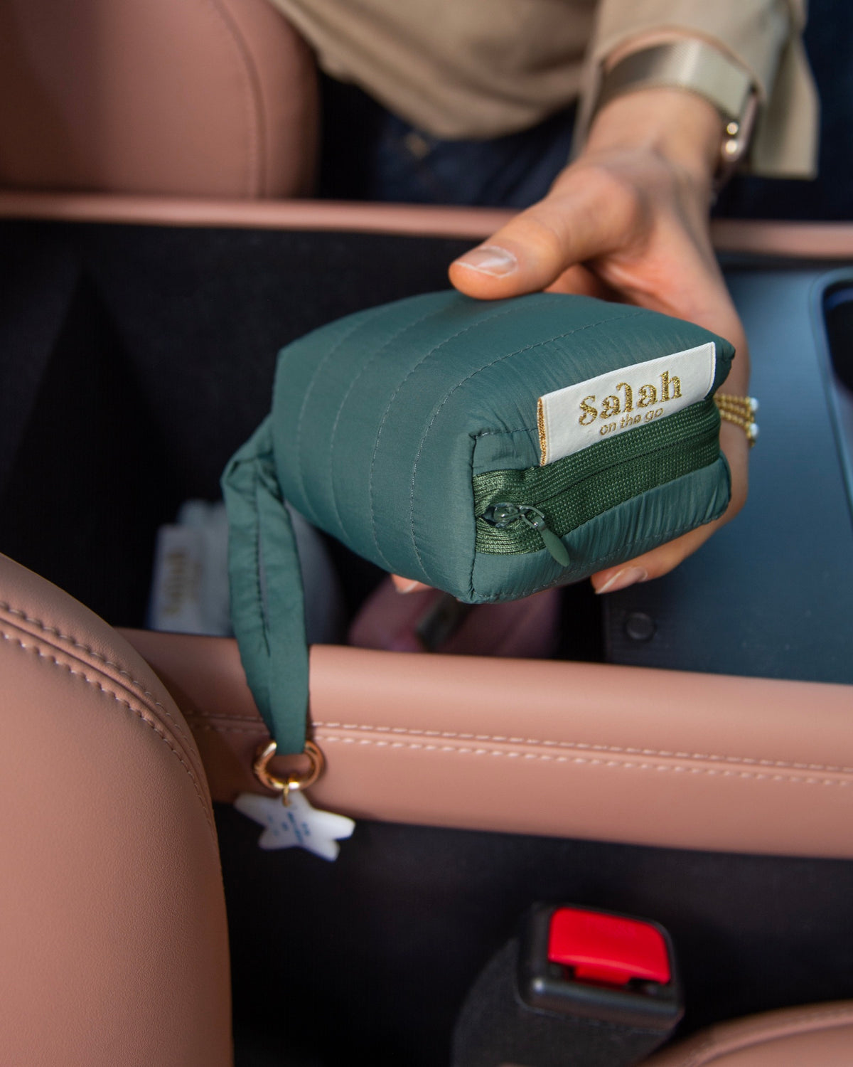 Close-up of the green folded portable prayer mat